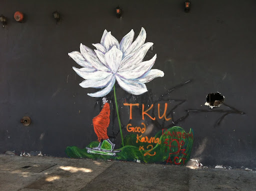 TKU Lotus and Skateboarding Priest: A Collaborative Street Art Project